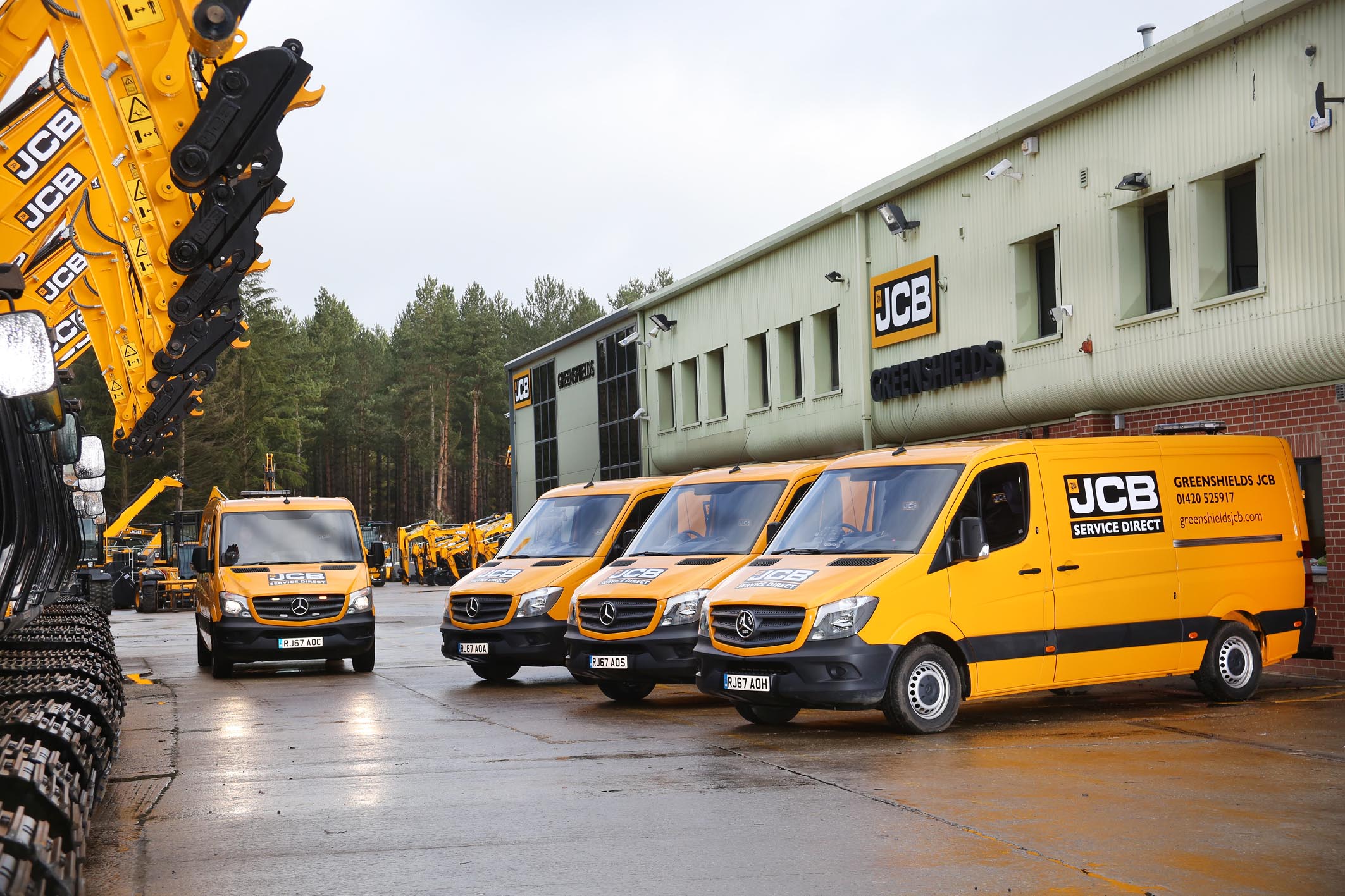 Greenshields JCB Service vans lined up outside the Farnham depot