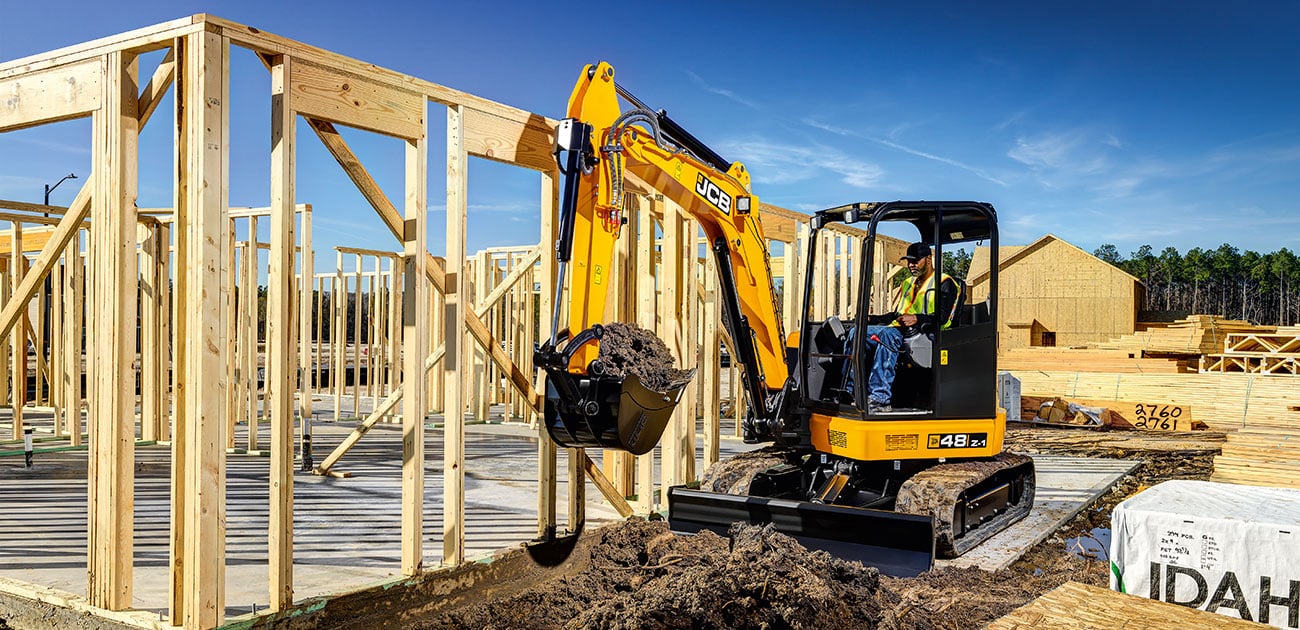 JCB 48Z-1 with a bucket full of dirt