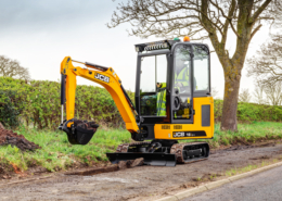 16C-1 Cab excavating material on path