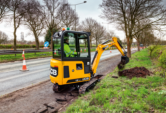 19C-1 Cab Mini Excavator dumping material beside road