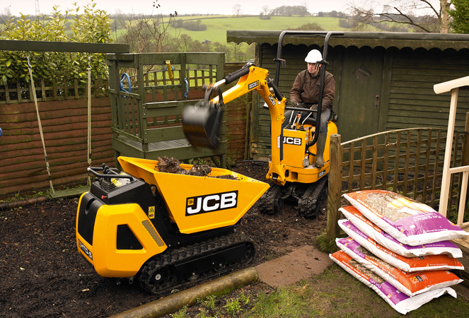 ME-8008-Dumping-Material 8008 Micro Excavator dumping material into HTD5 Dumpster