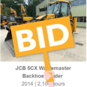 a backhoe with a bid paddle over the top of it