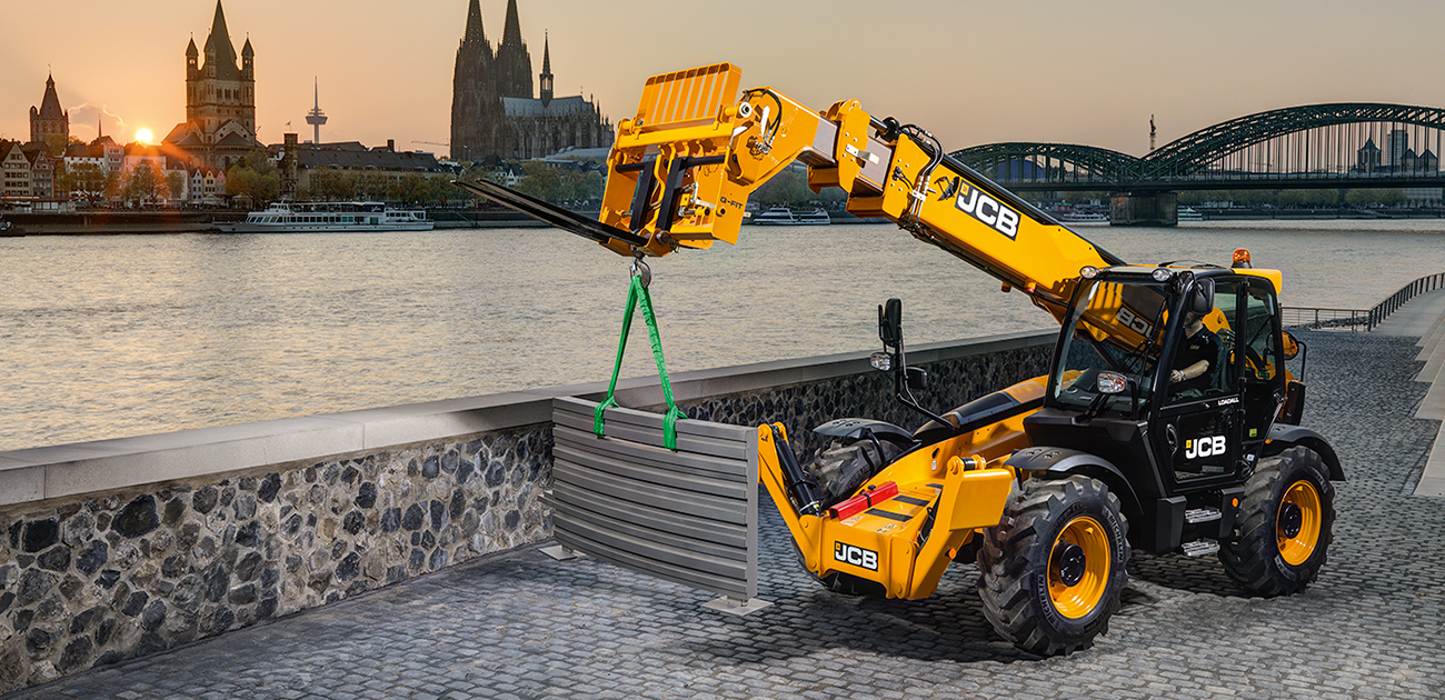 JCB 540v140 moving a fence panel