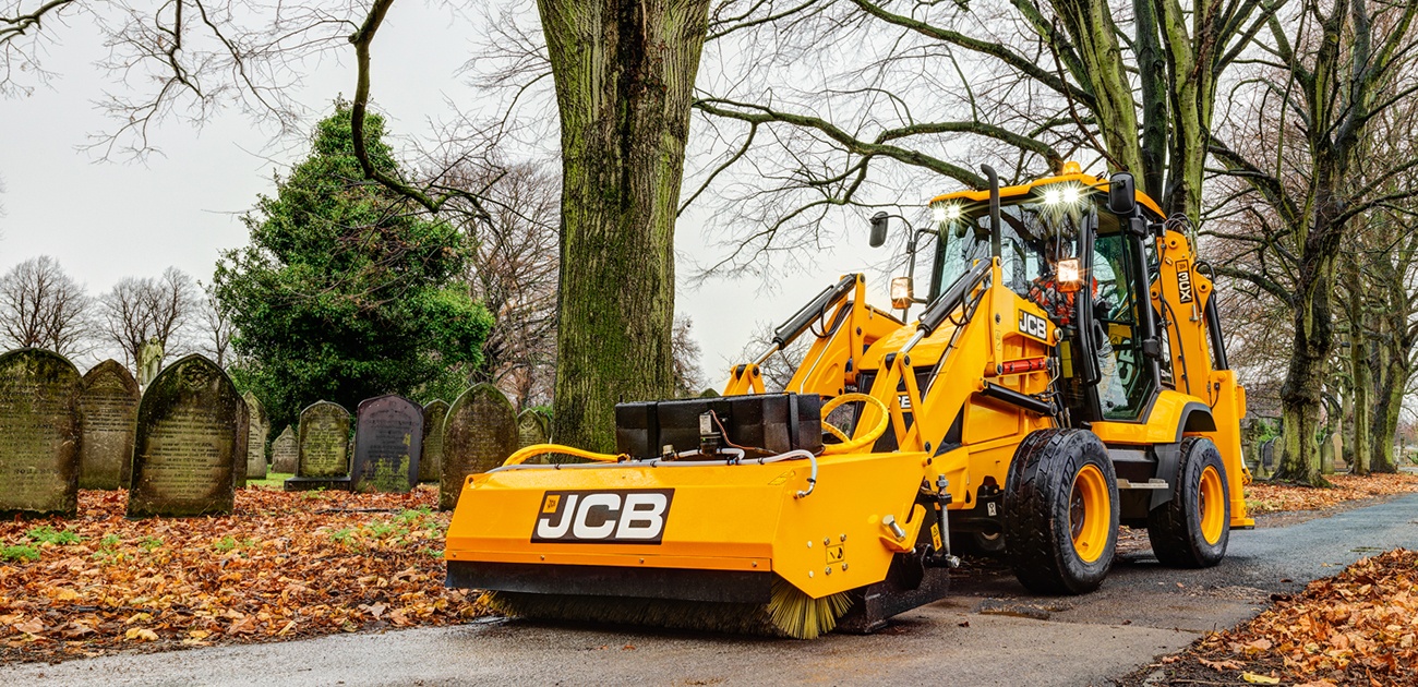 JCB 3CX with sweeper attachment