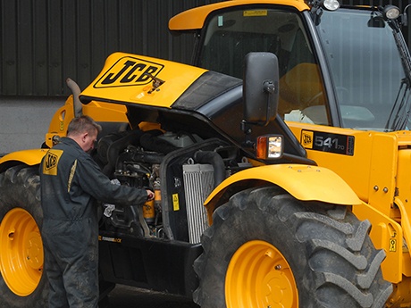 an Engineer working on a JCB 541-70