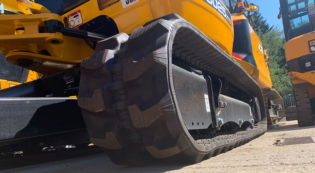 A Close up of rubber tracks on a JCB Mini Excavator