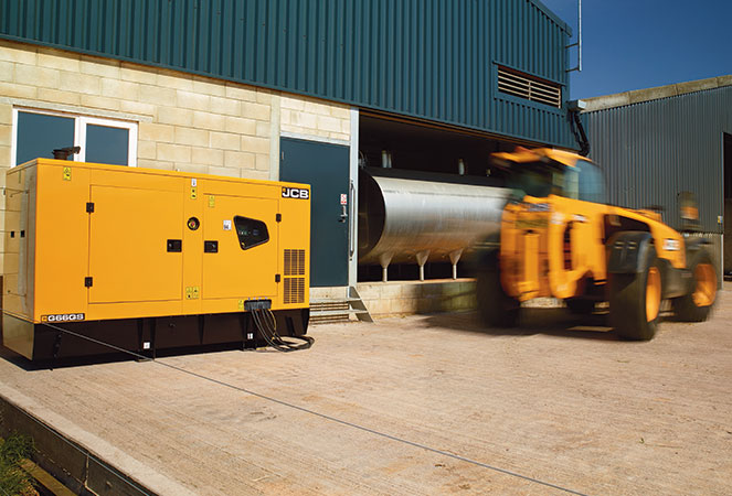 JCB G66QS with a telehandler driving past