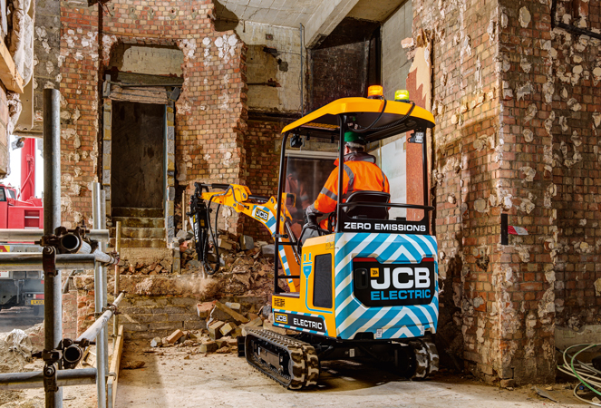 19C-1 E-Tech Mini Excavator using hydraulic breaker inside a building