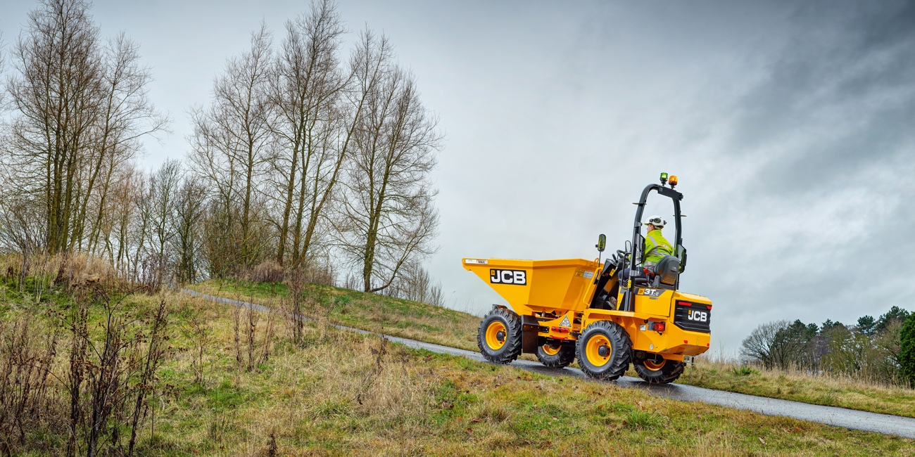 JCB 3T dumper driving up a hill