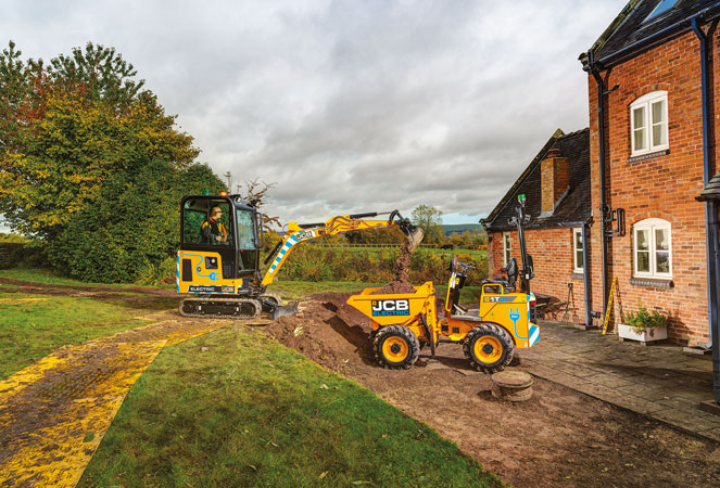 JCB 19C E-TECH unloading its bucket into a 1T-E Dumper