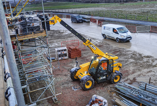 JCB 525-60 Telehandler loading some building materials onto scaffolding