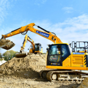 JCB Tracked Excavator signwritten for Coinford unloading its shovel