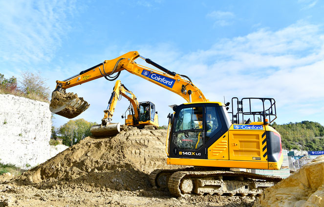 JCB Tracked Excavator signwritten for Coinford unloading its shovel