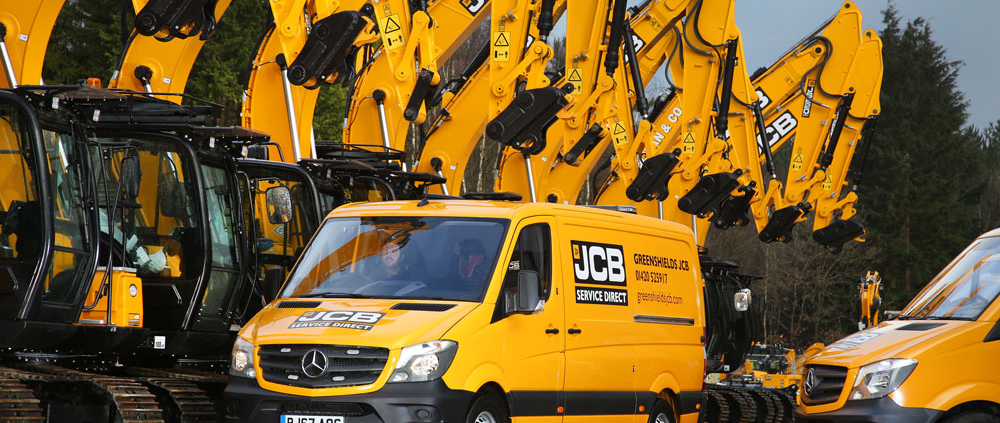 A Greenshields engineer van infront of a row of JCB Tracked Excavators