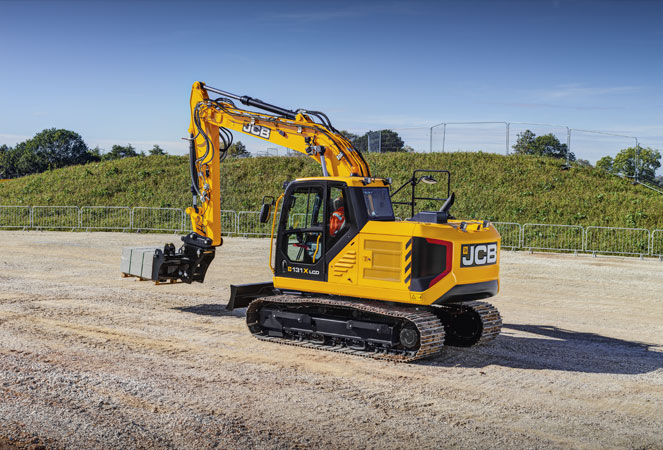 JCB 131X Tracked Excavator carrying a pallet of building materials