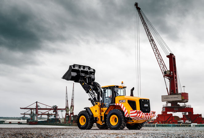 A 457 Wheel Loading Shovel with its shovel in the air