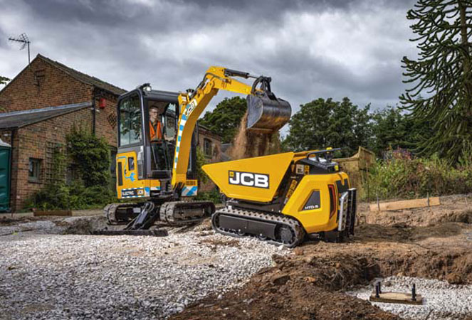 JCB 19C E-TECH Cab unloading its bucket into a JCB HTD-5 Dumpster