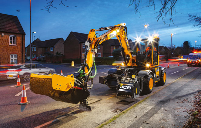 JCB Hydradig 110W Pothole Pro Wheeled Excavator repairing a road