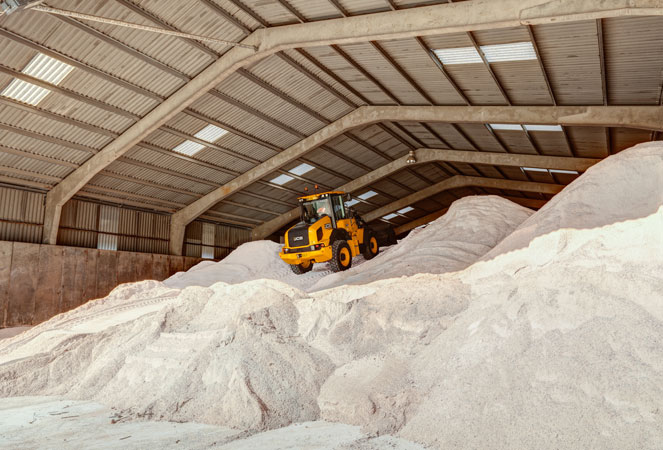 A 411 Wheel Loading Shovel on top of aggregate
