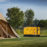 JCB G100RS next to a large tent